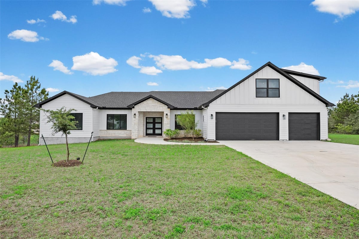 View 111 Tall Forest DR in Pine Forest Unit 10 P III 111 Tall Forest DR - front exterior - Luxury home in Pine Forest Unit 10 P III, Bastrop, TX