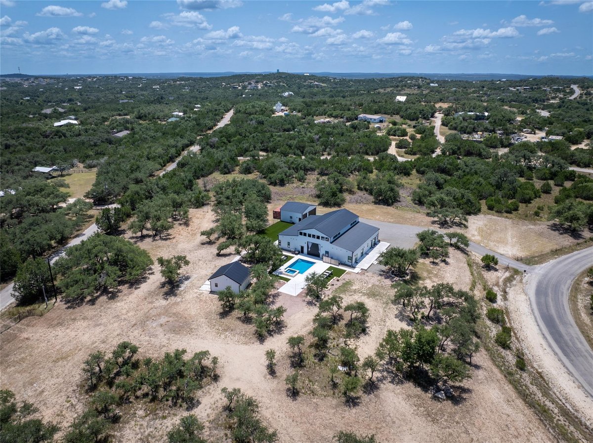 View 1118 Harmon Hills RD in Douglas Estates 1118 Harmon Hills RD - property photo 1 - Luxury home in Douglas Estates, Dripping Springs, TX