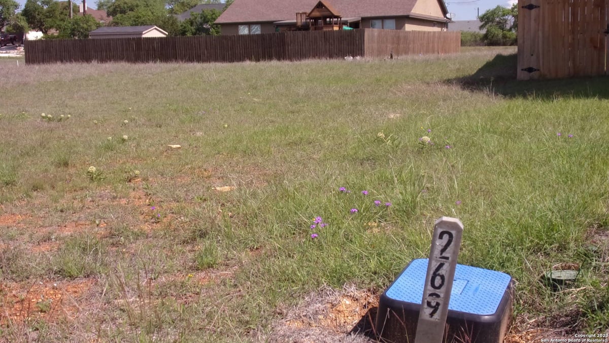 View 112 Hiram Cook Dr in ROCKIN J RANCH 112 Hiram Cook Dr - front exterior - Luxury lot in ROCKIN J RANCH, Blanco, TX