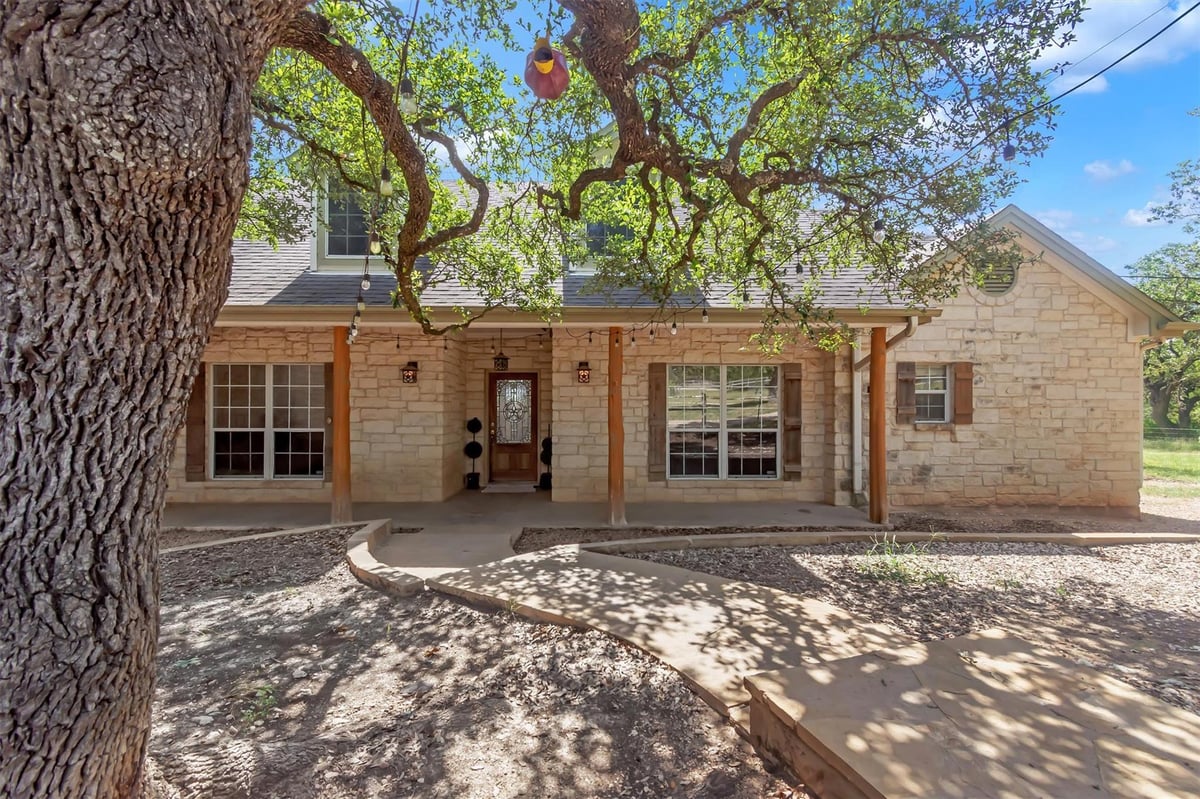View 1120 Meadow Ridge DR in Meadow Creek Ranch 1120 Meadow Ridge DR - front exterior - Luxury home in Meadow Creek Ranch, Dripping Springs, TX