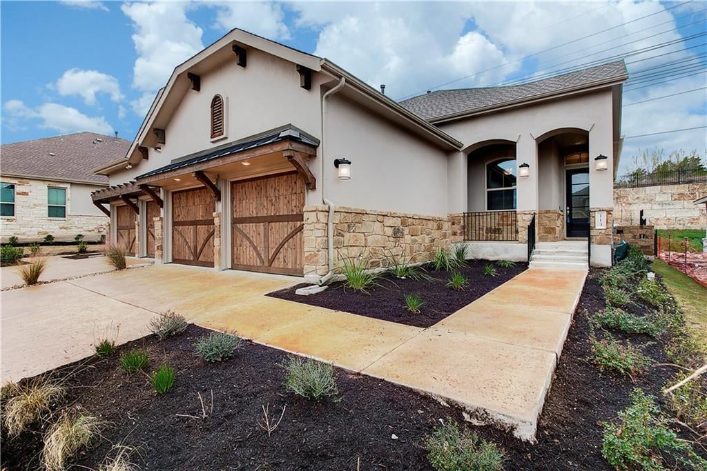 113 Cartwheel Bnd Unit #46 - front exterior - Luxury home in Vineyard at Rough Hollow, Austin, TX