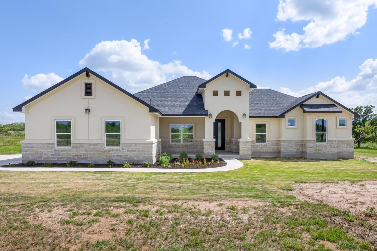 View 1136 Country Road 484 Rd in LODGES AT OPEN ACRES RANCH 1136 Country Road 484 Rd - front exterior - Luxury home in LODGES AT OPEN ACRES RANCH, Elgin, TX