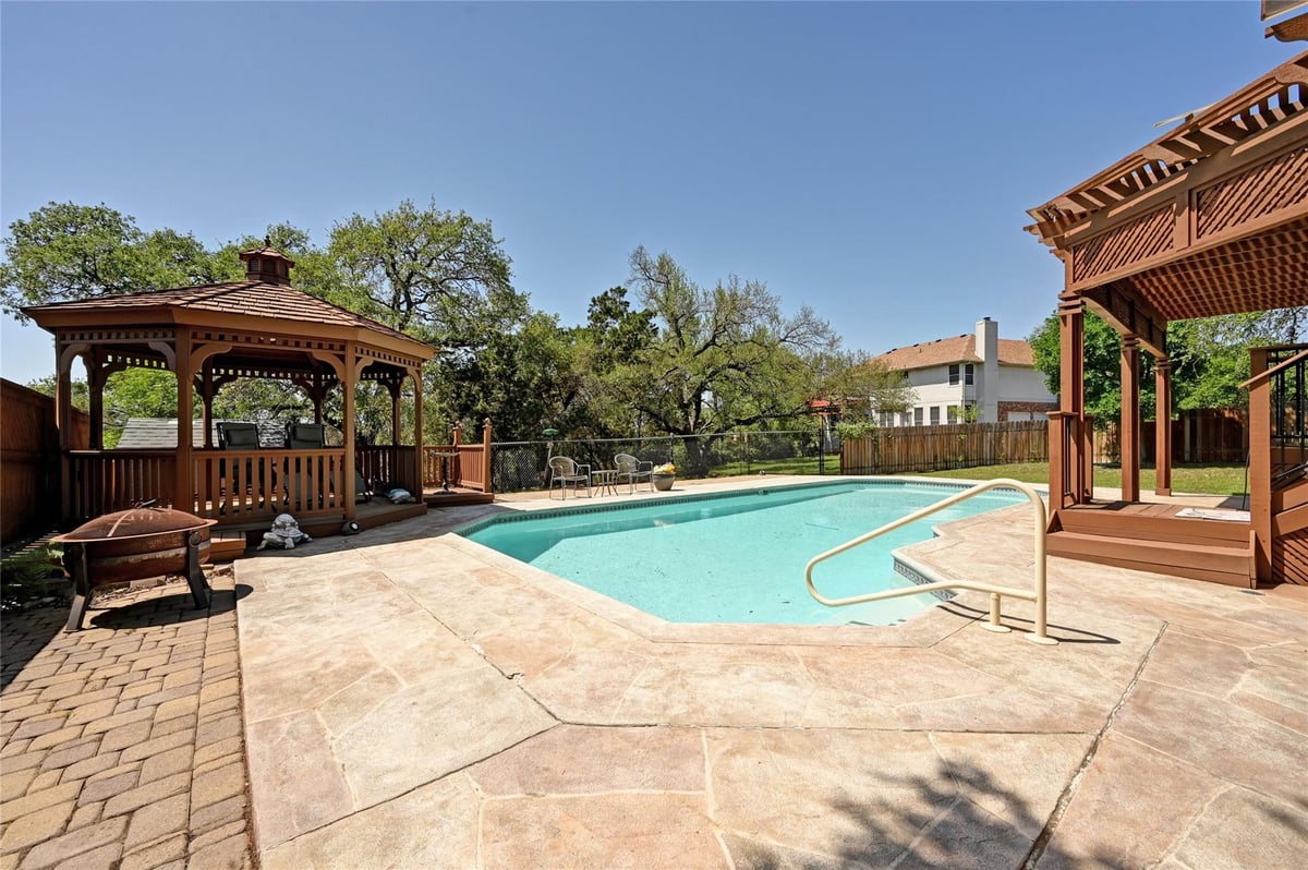 View 11446 Rustic Rock Dr in Tanglewood Estates 11446 Rustic Rock Dr - front exterior - Luxury home in Tanglewood Estates, Austin, TX