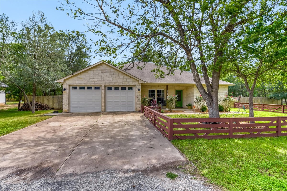 View 115 Mokulua LN in Tahitian Village 115 Mokulua LN - front exterior - Luxury home in Tahitian Village, Bastrop, TX