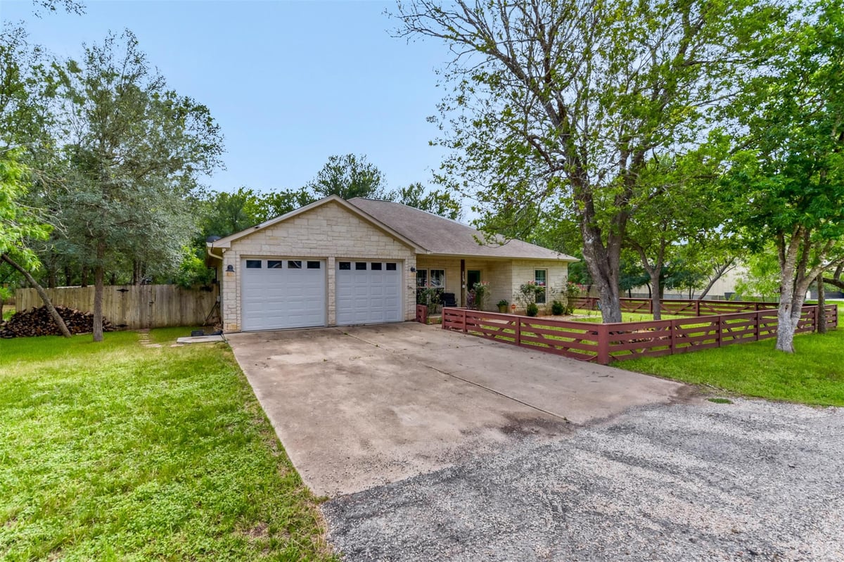 View 115 Mokulua LN in Tahitian Village 115 Mokulua LN - front exterior - Luxury home in Tahitian Village, Bastrop, TX