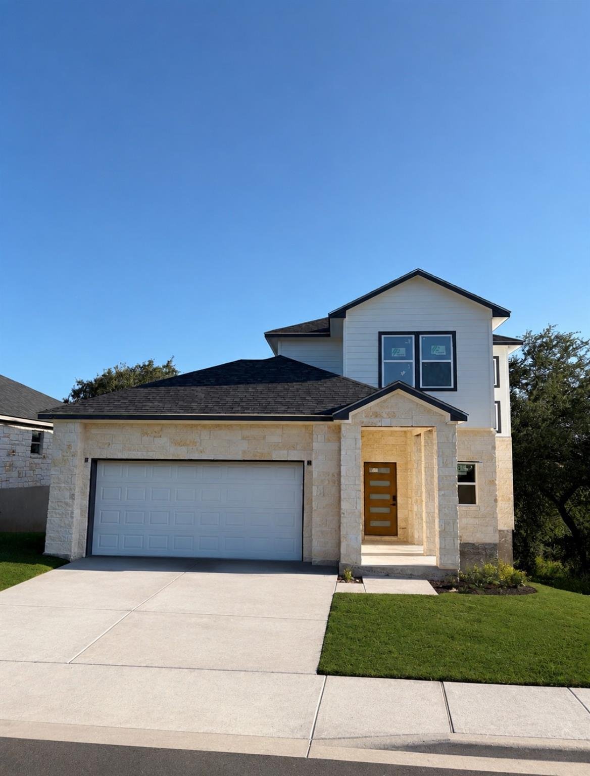View 116 E Wildflower BLVD in Wildflower Village 116 E Wildflower BLVD - front exterior - Luxury home in Wildflower Village, Marble Falls, TX
