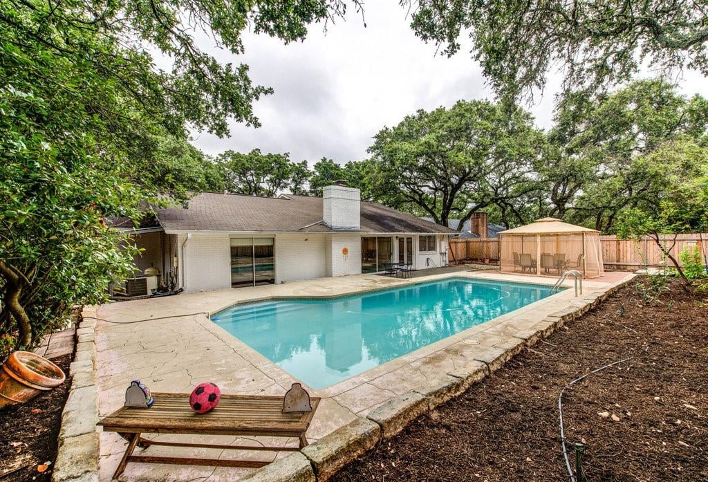 View 11700 Three Oaks Trl in Oak Forest Sec 02 11700 Three Oaks Trl - front exterior - Luxury home in Oak Forest Sec 02, Austin, TX