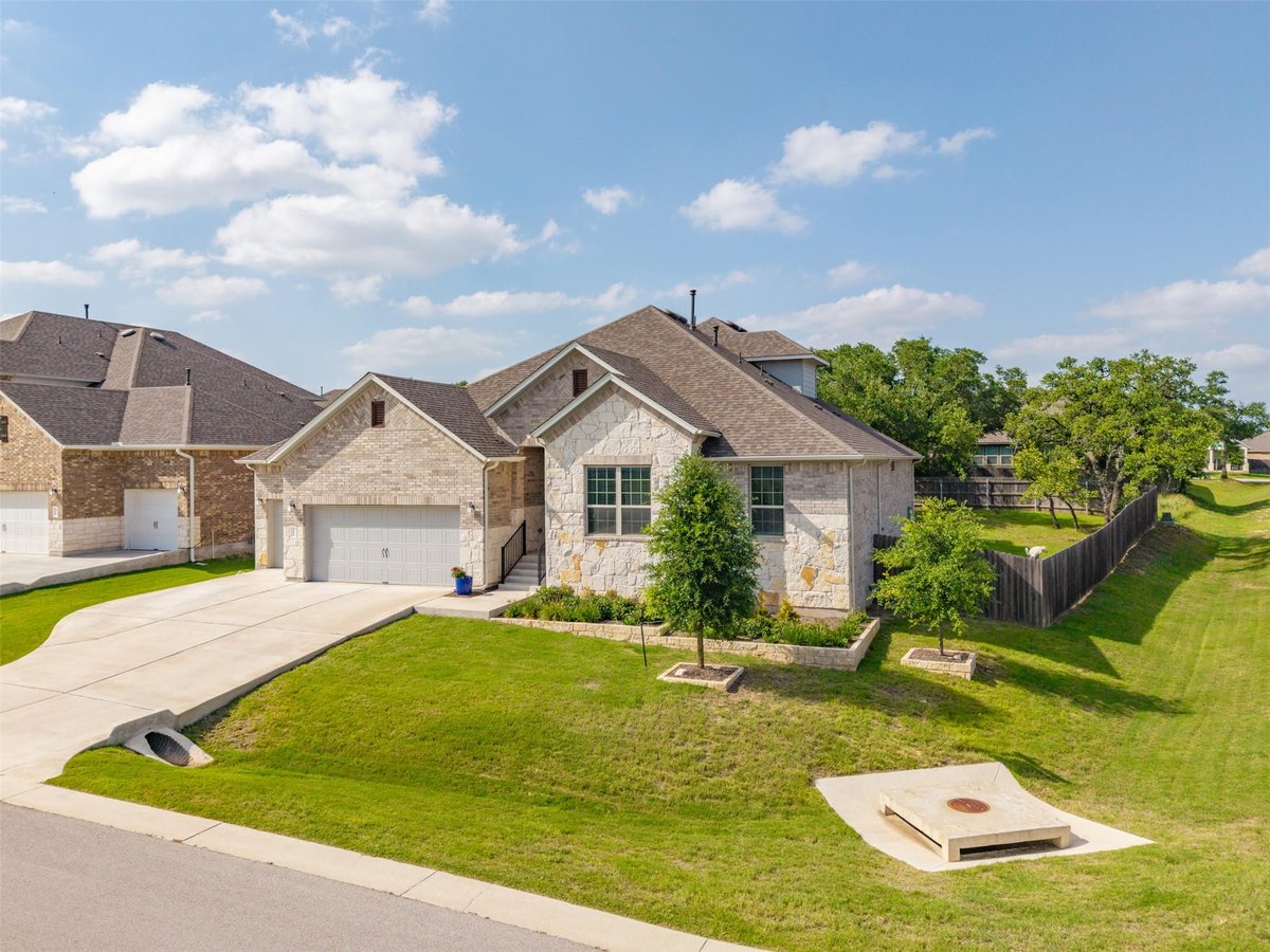 View 1173 Pink Granite BLVD in Arrowhead Ranch Ph 3 1173 Pink Granite BLVD - front exterior - Luxury home in Arrowhead Ranch Ph 3, Dripping Springs, TX
