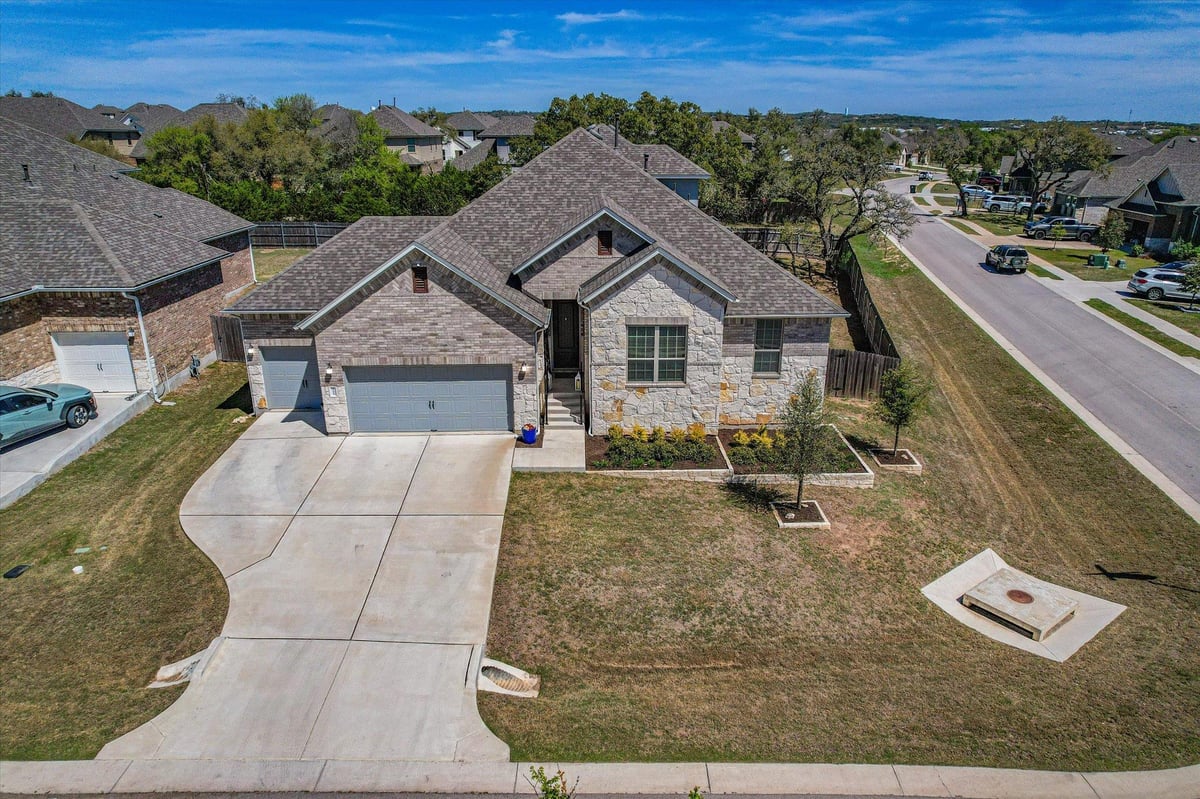 View 1173 Pink Granite BLVD in Arrowhead Ranch Ph 3 1173 Pink Granite BLVD - front exterior - Luxury home in Arrowhead Ranch Ph 3, Dripping Springs, TX