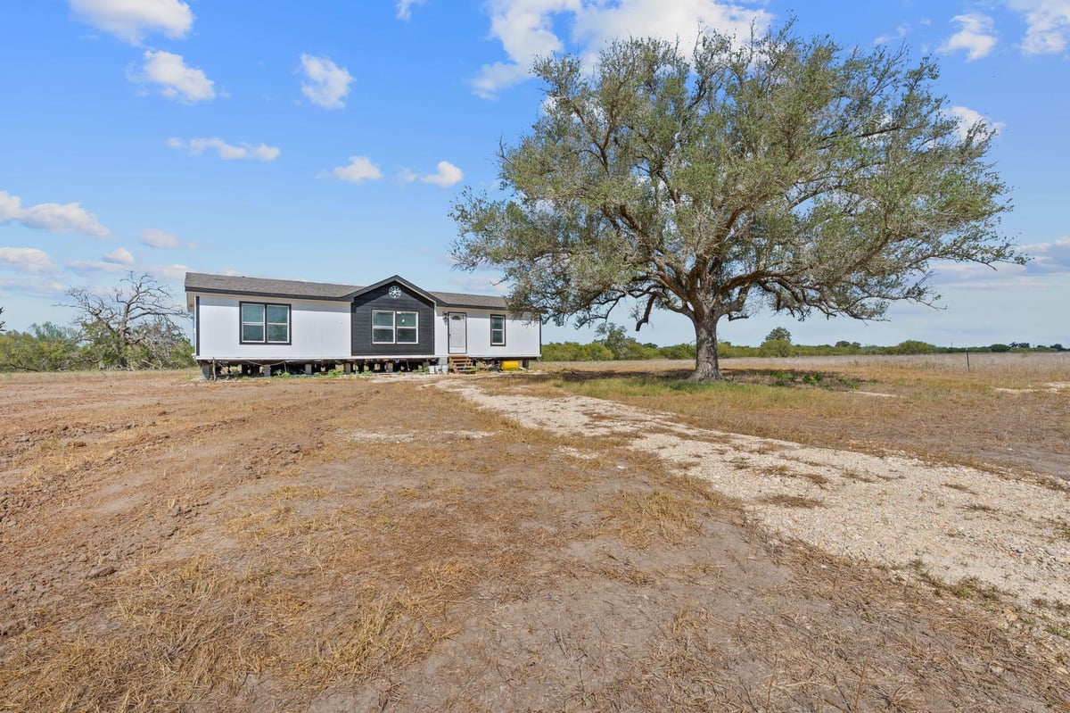 View 1177 County Road 402 in Aquila Acres 1177 County Road 402 - front exterior - Luxury home in Aquila Acres, Flatonia, TX