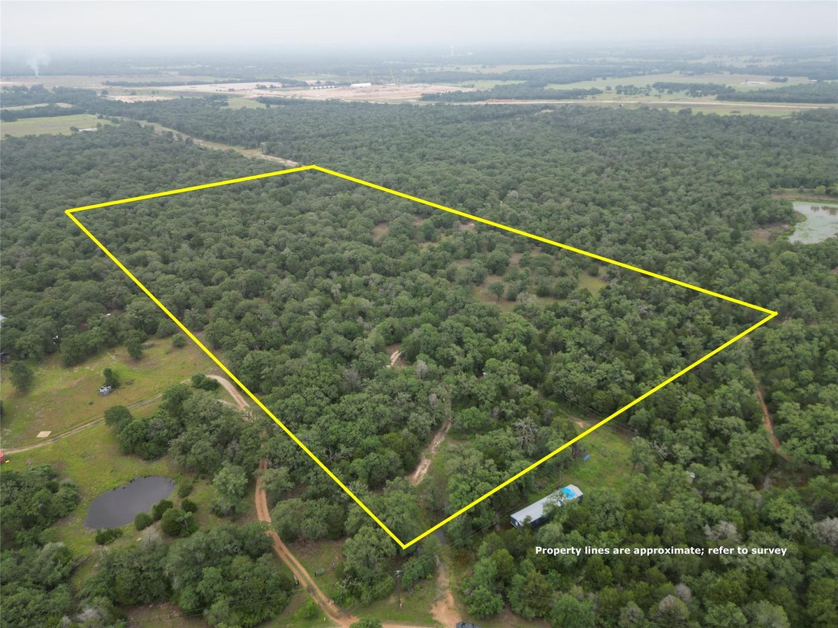 View 1178 Private Road 3063 in W Harrison Surv Abs #162 1178 Private Road 3063 - front exterior - Luxury home in W Harrison Surv Abs #162, Lexington, TX