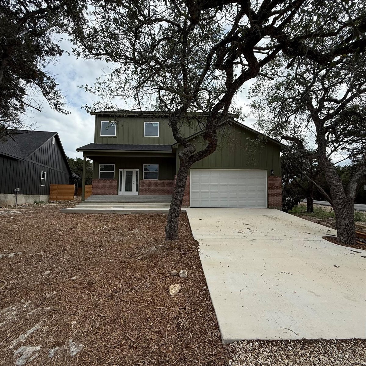 View 118 Crazy Cross Rd in Woodcreek Sec 20 118 Crazy Cross Rd - front exterior - Luxury home in Woodcreek Sec 20, Wimberley, TX