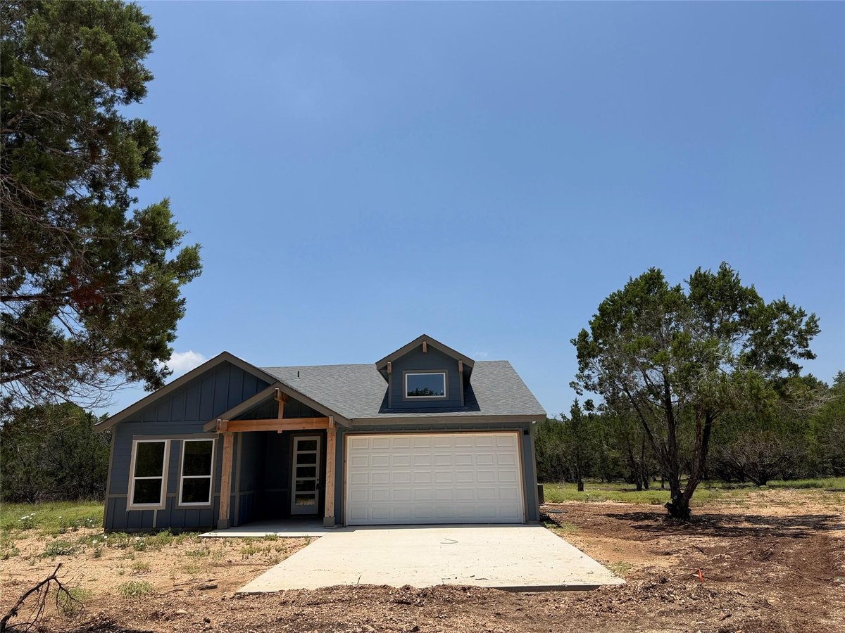 View 12 Meadow Oak CT in Woodcreek Sec 12 12 Meadow Oak CT - front exterior - Luxury home in Woodcreek Sec 12, Wimberley, TX