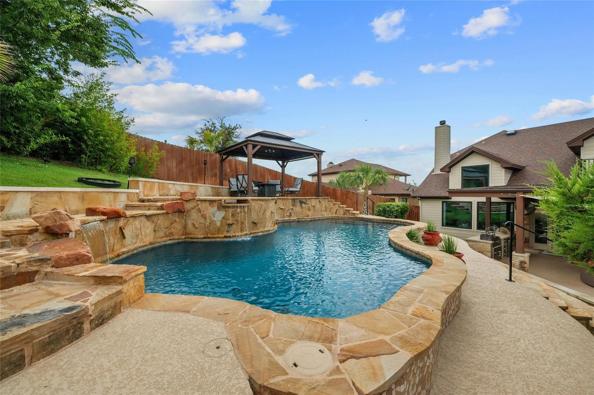 View 1207 Sledge DR in Cardinal Hills Unit 06 1207 Sledge DR - front exterior - Luxury home in Cardinal Hills Unit 06, Austin, TX