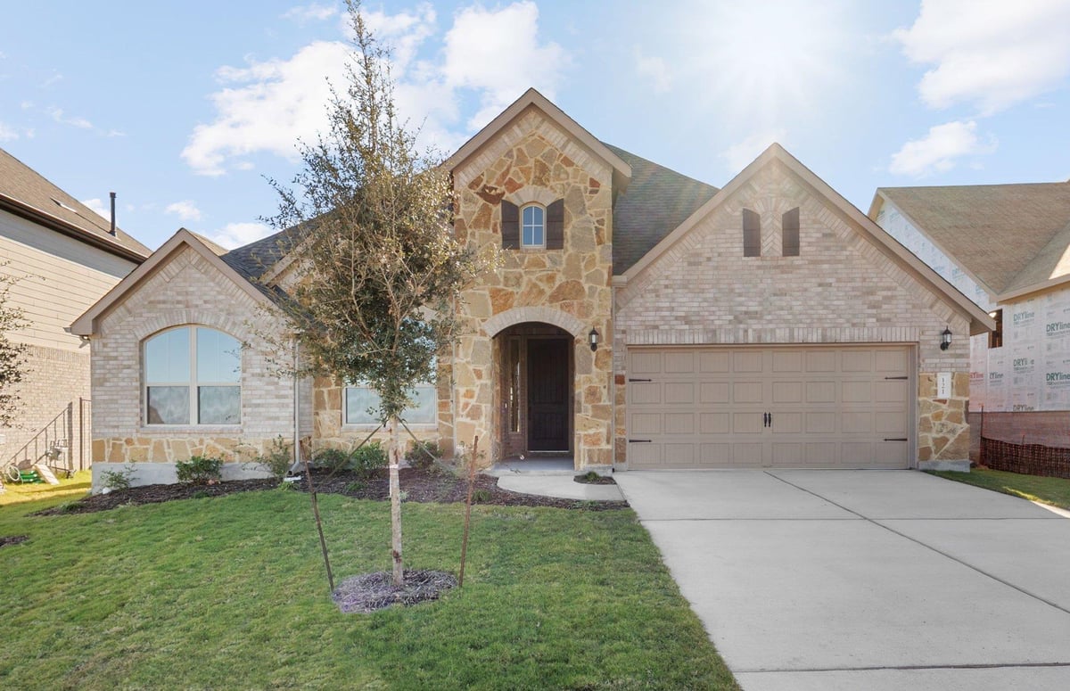 View 121 Keswick St in Santa Rita Ranch at Saddleback 121 Keswick St - front exterior - Luxury home in Santa Rita Ranch at Saddleback, Liberty Hill, TX