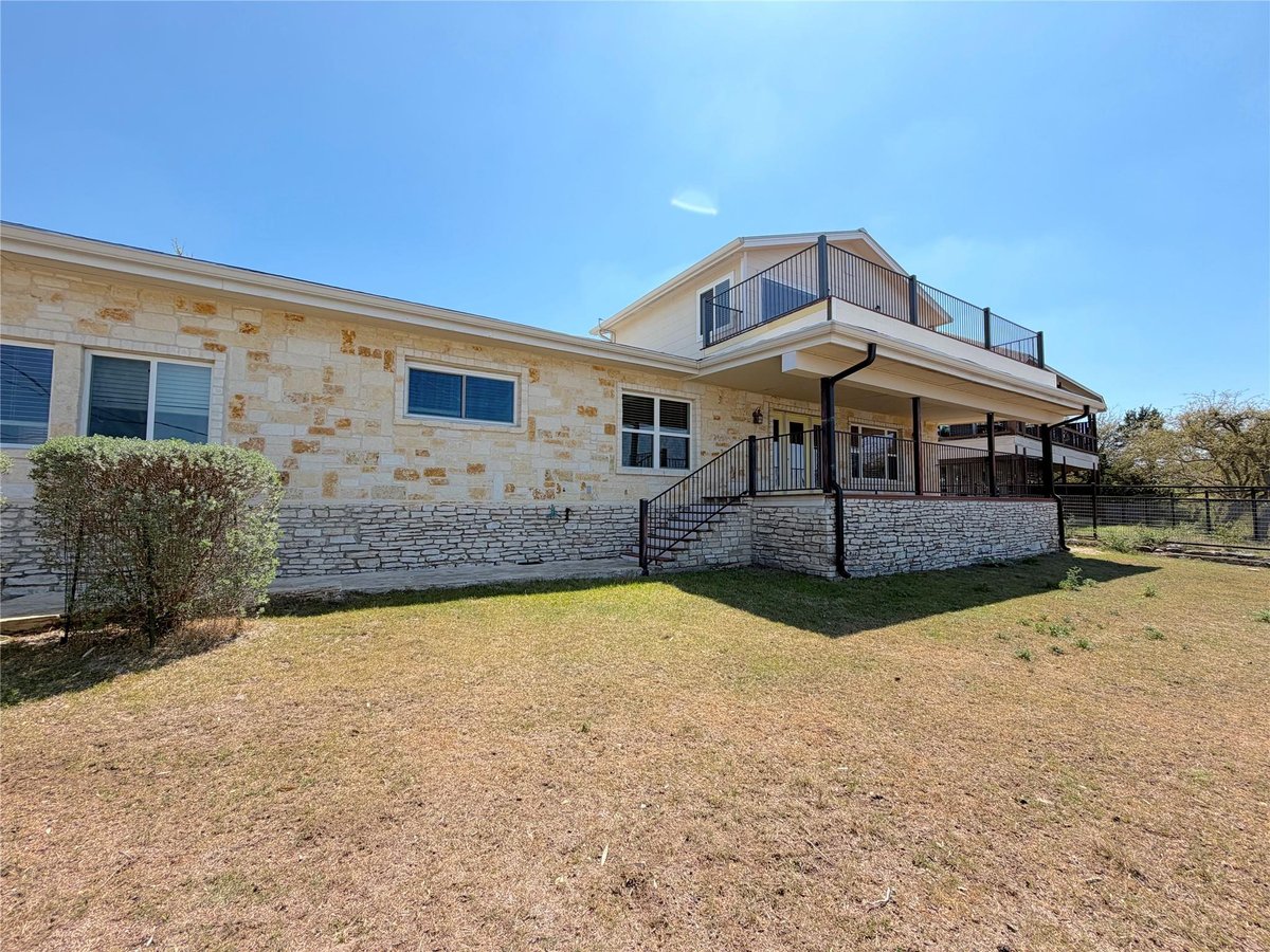 View 1210 Skyline Dr in Saddle Bronc Acres 1210 Skyline Dr - front exterior - Luxury home in Saddle Bronc Acres, Canyon Lake, TX