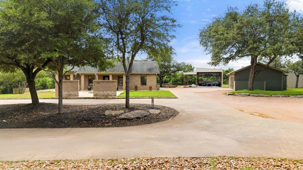 View 12135 Fitzhugh RD in NA 12135 Fitzhugh RD - front exterior - Luxury home in NA, Austin, TX