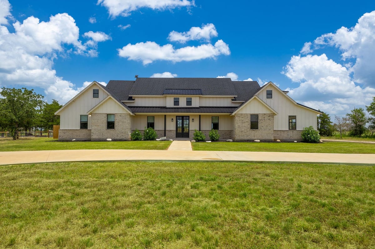 View 1215 Private Road 7039 in Fedor Estates Sec 3 1215 Private Road 7039 - front exterior - Luxury home in Fedor Estates Sec 3, Lexington, TX