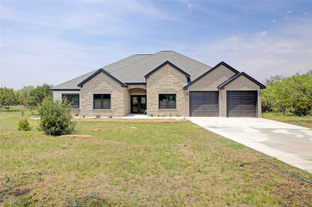 View 1215 Ridge Harbor Dr in Ridge Harbor 1215 Ridge Harbor Dr - front exterior - Luxury home in Ridge Harbor, Spicewood, TX
