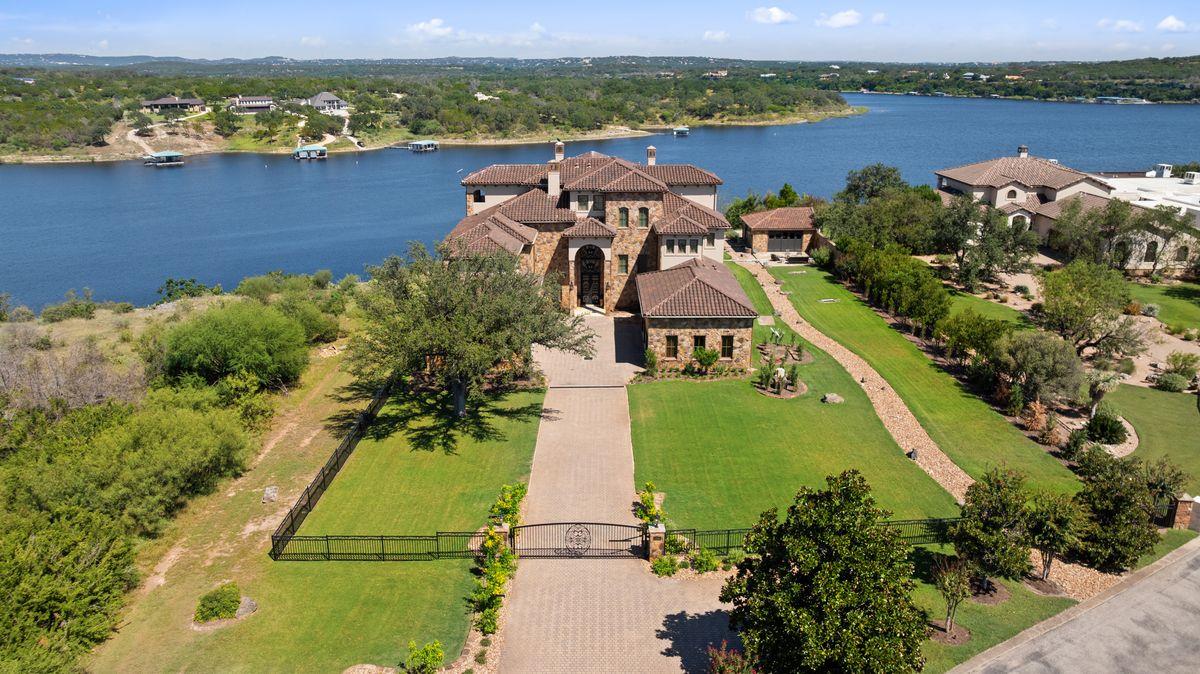 View 1216 Travis Bluff Way in Travis Bluff Rev 1216 Travis Bluff Way - front exterior - Luxury home in Travis Bluff Rev, Spicewood, TX