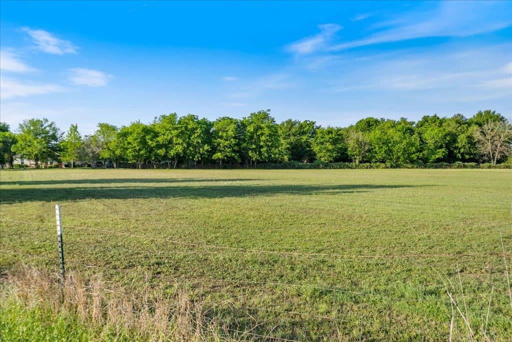 Backyard with expansive acreage and mature tree line at 1218  Lovers Ln - Austin, Stephen F, Bastrop, TX