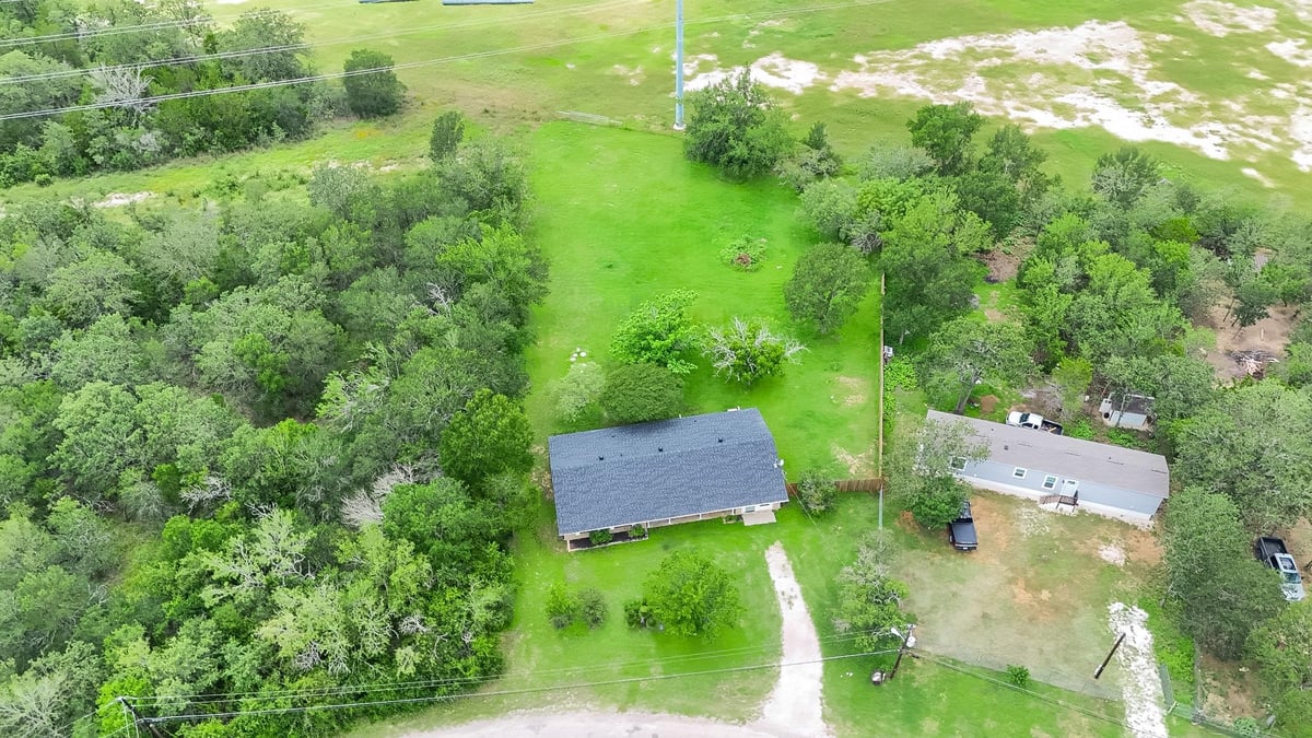 View 122 Blanket Flower DR in Lake Bastrop Acres 122 Blanket Flower DR - front exterior - Luxury home in Lake Bastrop Acres, Bastrop, TX
