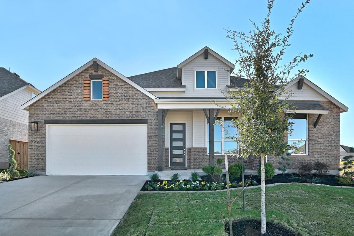 View 122 Stock Pond Trl in 6 Creeks at Waterridge 122 Stock Pond Trl - front exterior - Luxury home in 6 Creeks at Waterridge, Kyle, TX