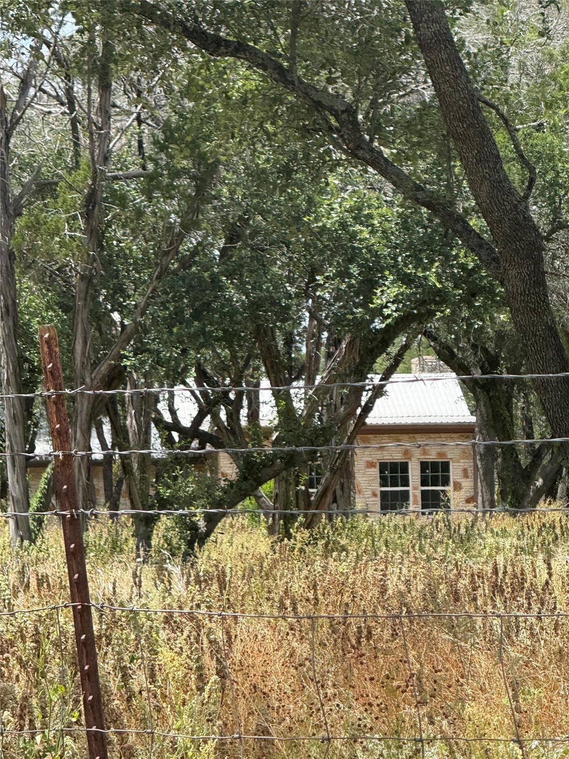 View 122 Winding Creek RD in None 122 Winding Creek RD - front exterior - Luxury home in None, Spicewood, TX