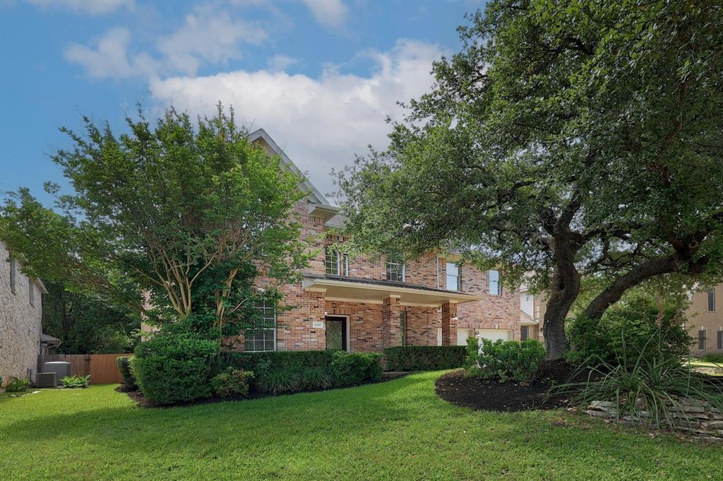 View 12207 Carlsbad Dr in Lake Pointe Ph 04-A 12207 Carlsbad Dr - front exterior - Luxury home in Lake Pointe Ph 04-A, Austin, TX