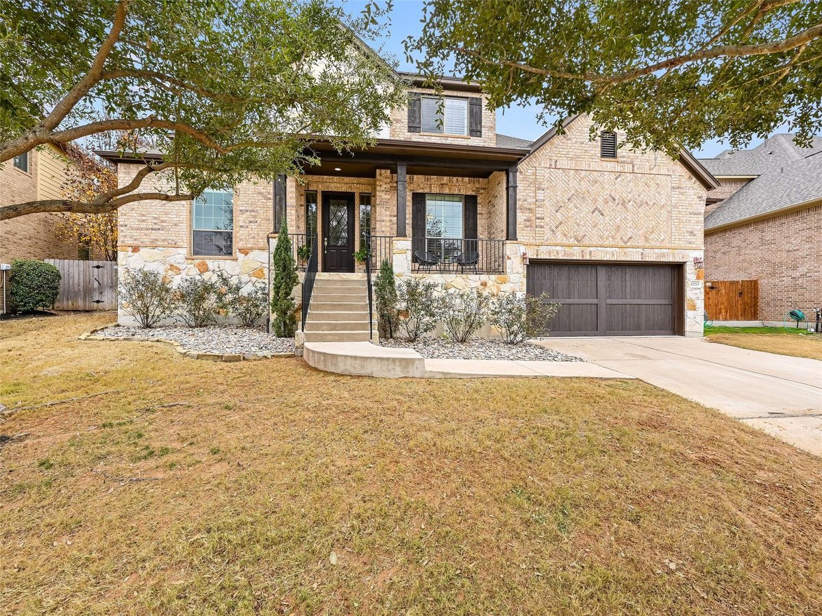 View 12213 Labrador Bay Ct in River Dance Ph 7-B 12213 Labrador Bay Ct - front exterior - Luxury home in River Dance Ph 7-B, Austin, TX