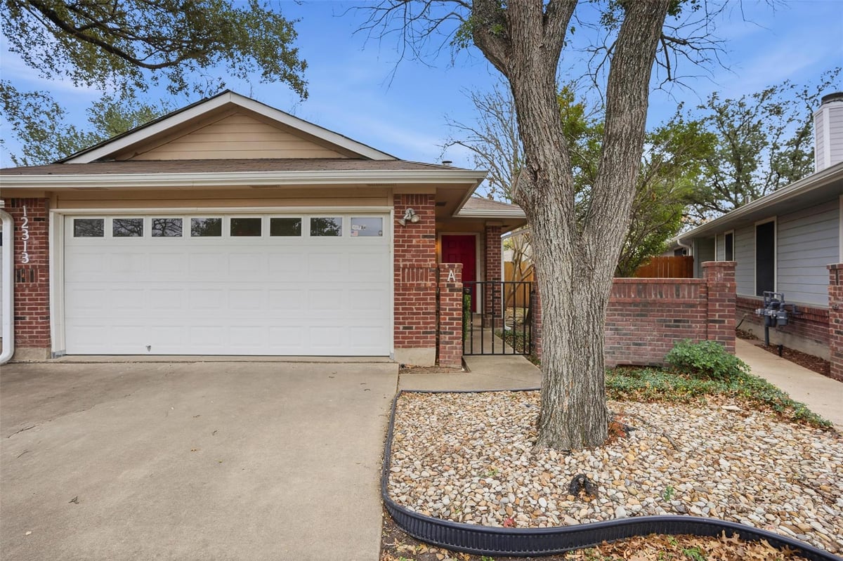 View 12313 Furrow CV Unit #A in Copperfield Twnhms Ph 01 Amd 12313 Furrow CV Unit #A - front exterior - Luxury home in Copperfield Twnhms Ph 01 Amd, Austin, TX