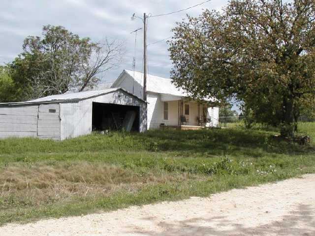 View 124 Duck Pond RD 124 Duck Pond RD - front exterior - Luxury home in McDade, TX