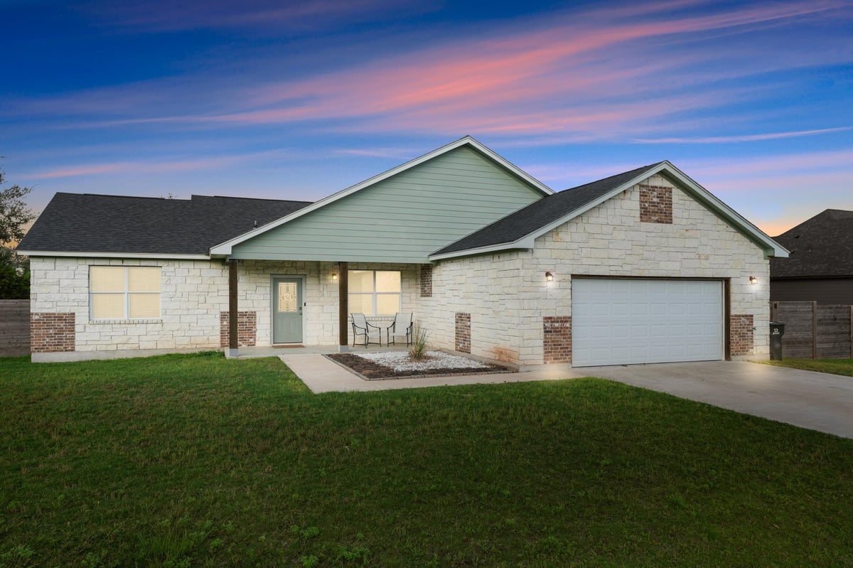 View 125 Naalehu CT in TAHITIAN VILLAGE 125 Naalehu CT - front exterior - Luxury home in TAHITIAN VILLAGE, Bastrop, TX