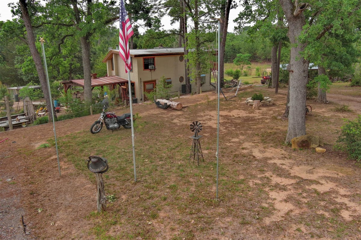 View 125 Turkey Trot RD in Turkey Run 125 Turkey Trot RD - front exterior - Luxury home in Turkey Run, Smithville, TX