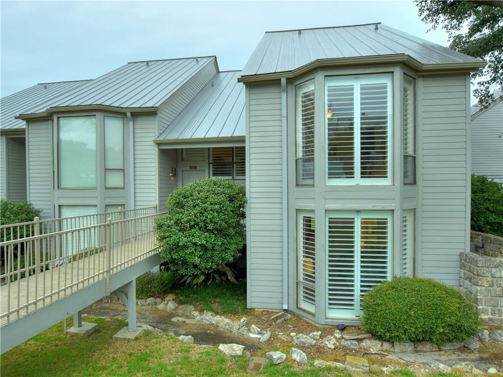 View 125 World Of Tennis SQ 125 World Of Tennis SQ - front exterior - Luxury home in Lakeway, TX