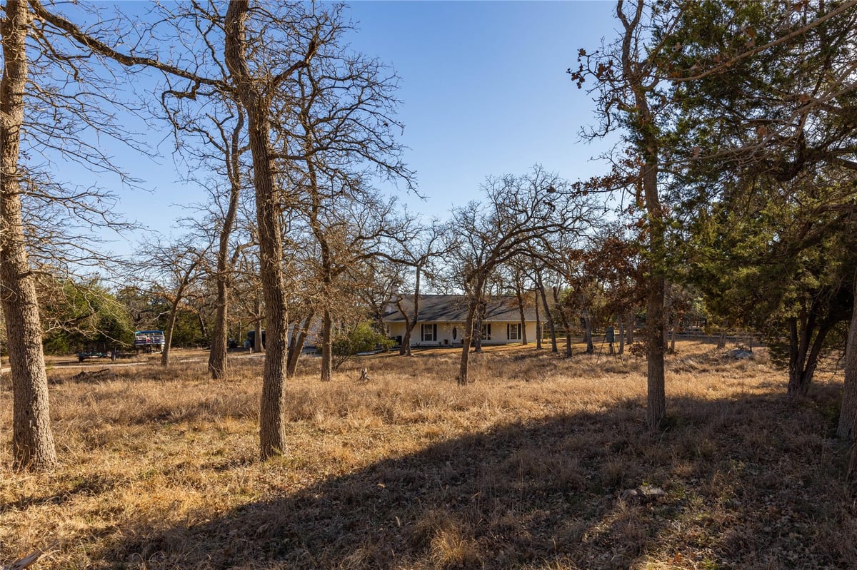View 1250 S Rainbow Ranch Rd in Rainbow Ranch 1250 S Rainbow Ranch Rd - front exterior - Luxury home in Rainbow Ranch, Wimberley, TX