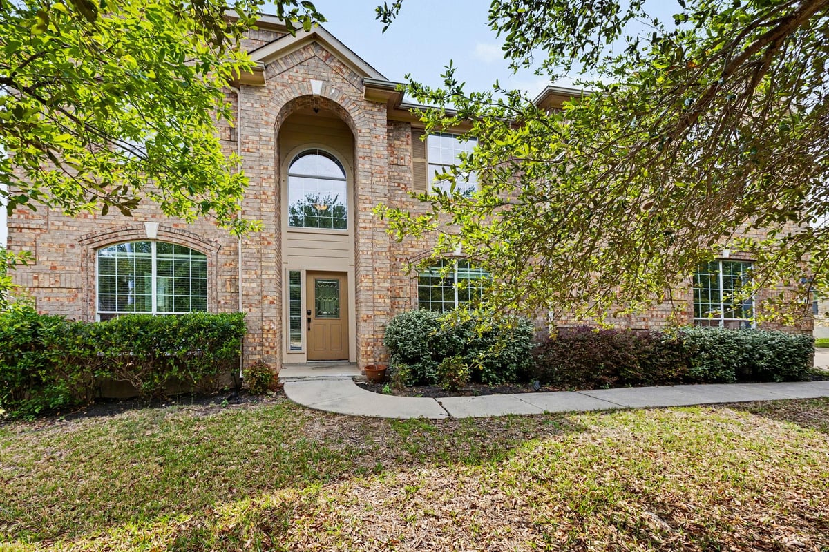 View 12504 Gun Metal Dr in Barker Ranch At Shady Hollow 12504 Gun Metal Dr - front exterior - Luxury home in Barker Ranch At Shady Hollow, Austin, TX