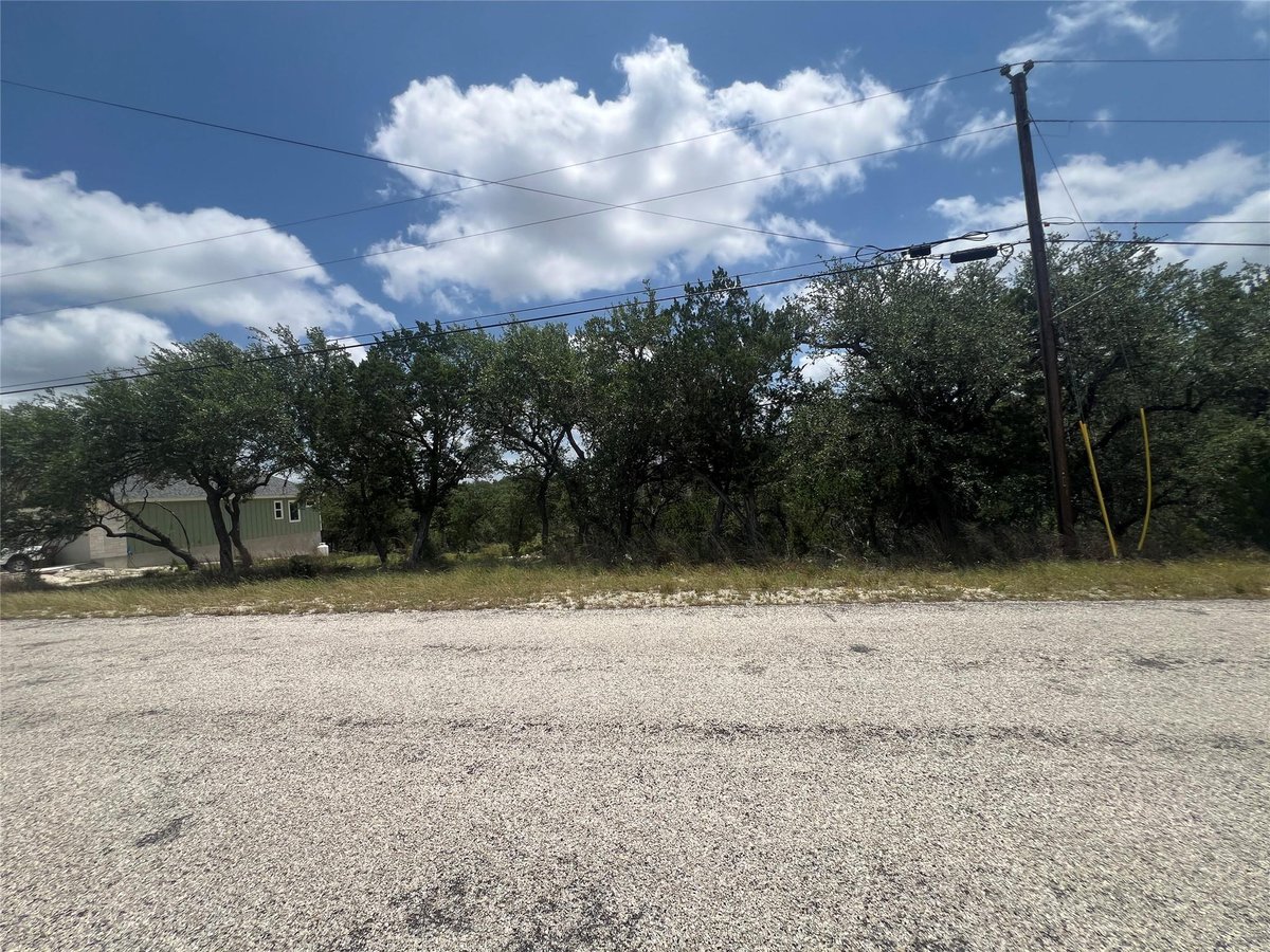 View 1252 Parton RD in Point Rancho Del Lago 5 1252 Parton RD - front exterior - Luxury lot in Point Rancho Del Lago 5, Canyon Lake, TX