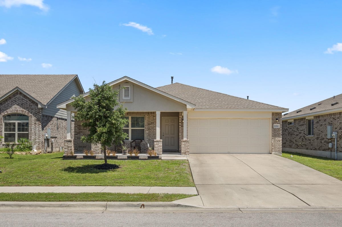 12520 Woodcock Way - front exterior - Luxury home in Village at Manor Commons, Manor, TX
