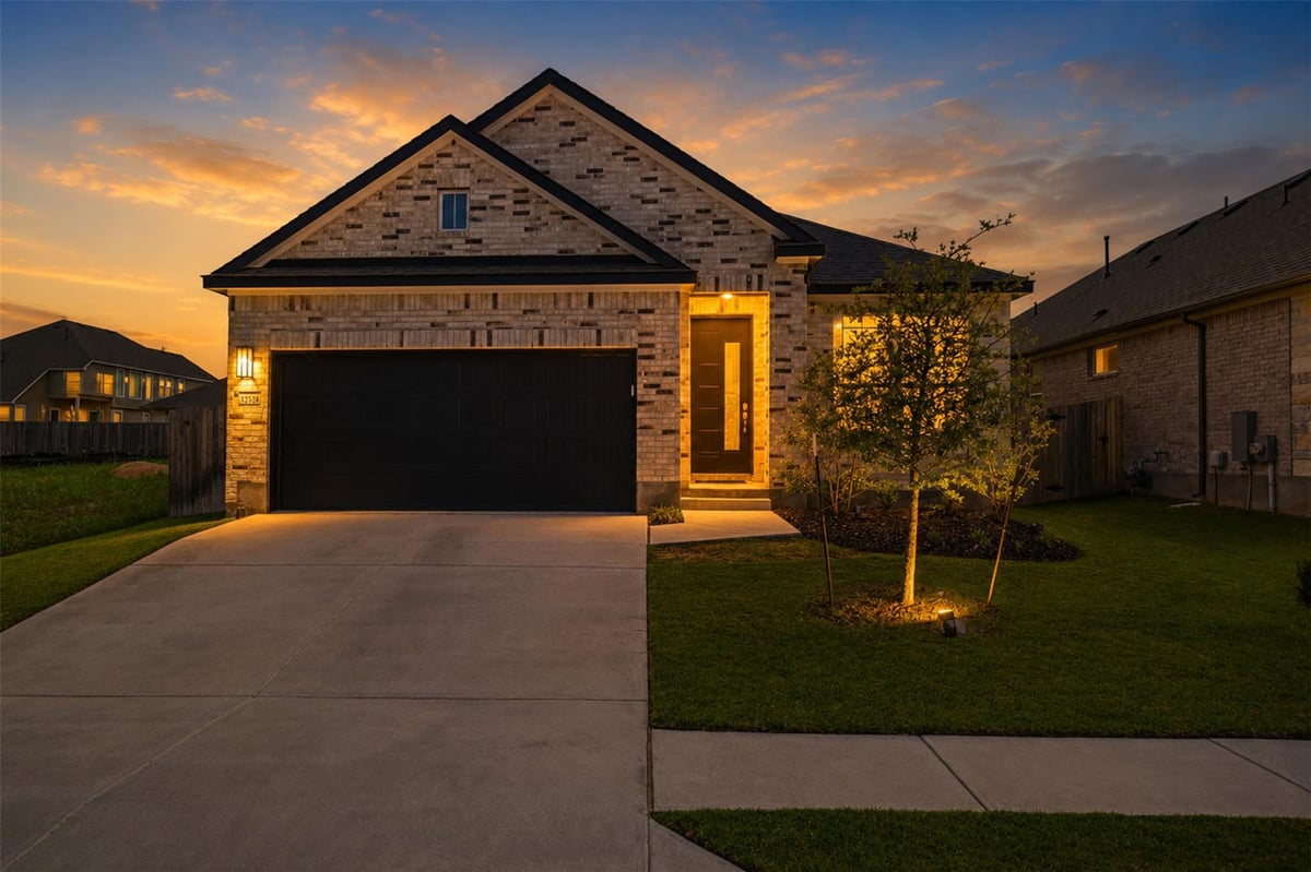 View 12528 Cockatoo XING in Village at Manor Commons Ph 3 12528 Cockatoo XING - front exterior - Luxury home in Village at Manor Commons Ph 3, Manor, TX