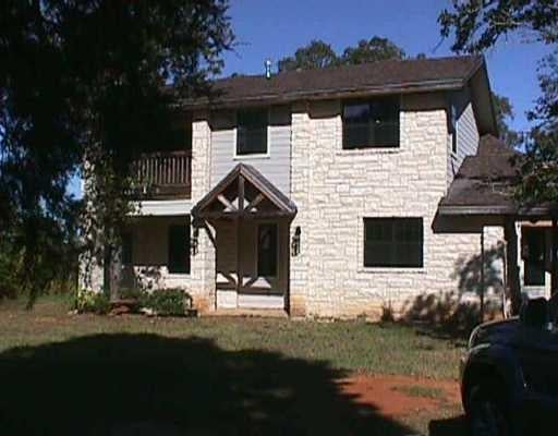 View 1260 Walch LN 1260 Walch LN - front exterior - Luxury home in Lexington, TX