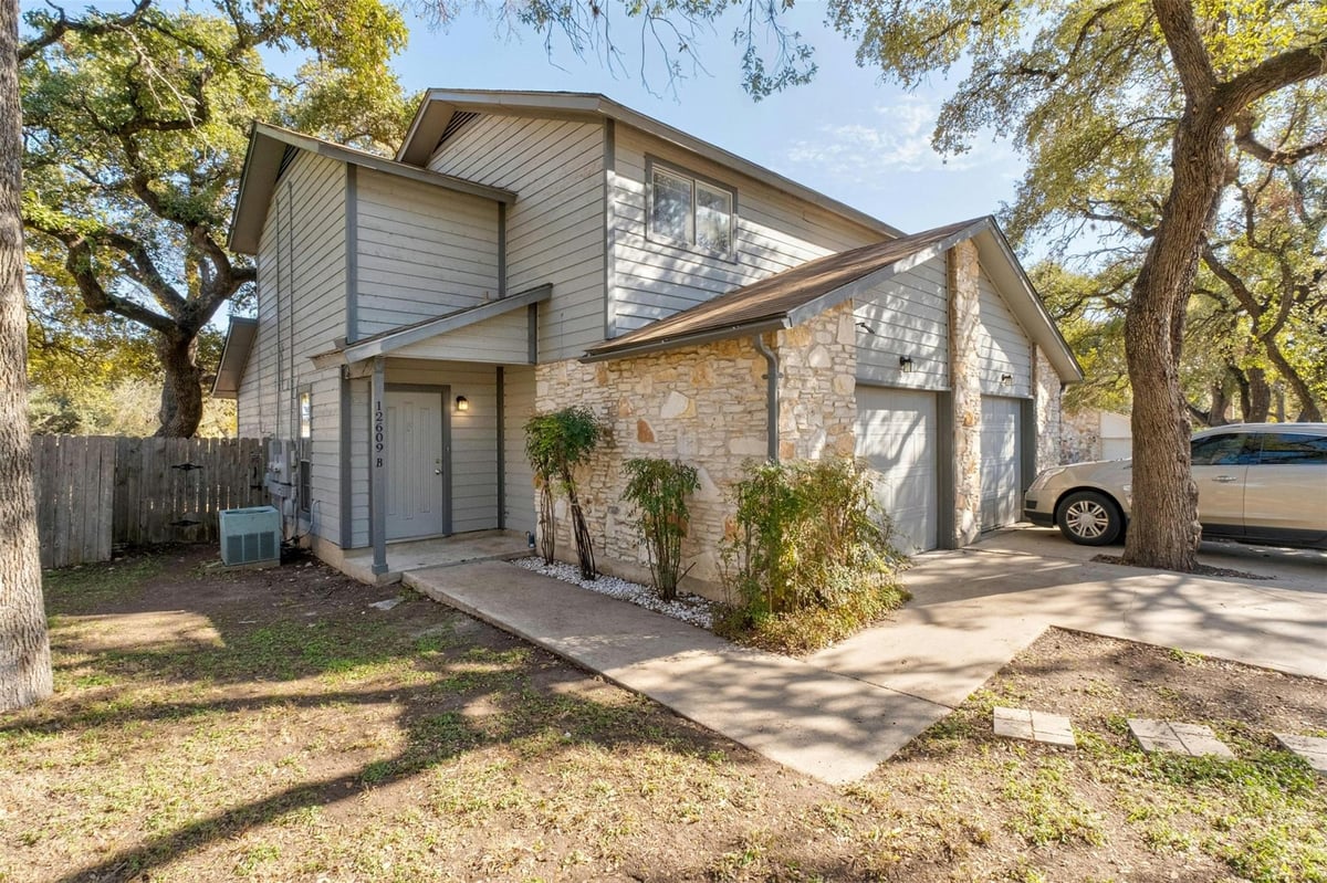 View 12609 Tree Line Dr in Springwoods Sec 01 12609 Tree Line Dr - front exterior - Luxury home in Springwoods Sec 01, Austin, TX