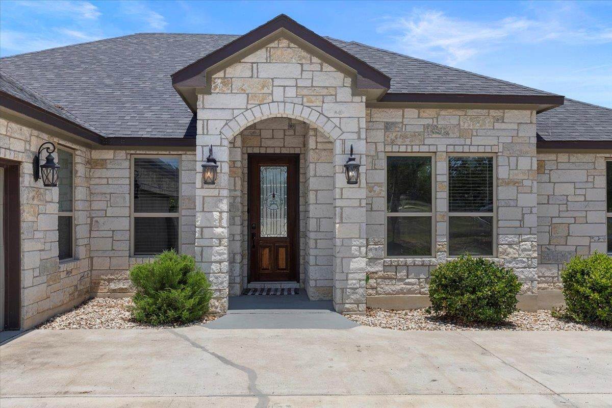 View 127 Medlar Dr in Cedar Creek Estates 127 Medlar Dr - front exterior - Luxury home in Cedar Creek Estates, Cedar Creek, TX