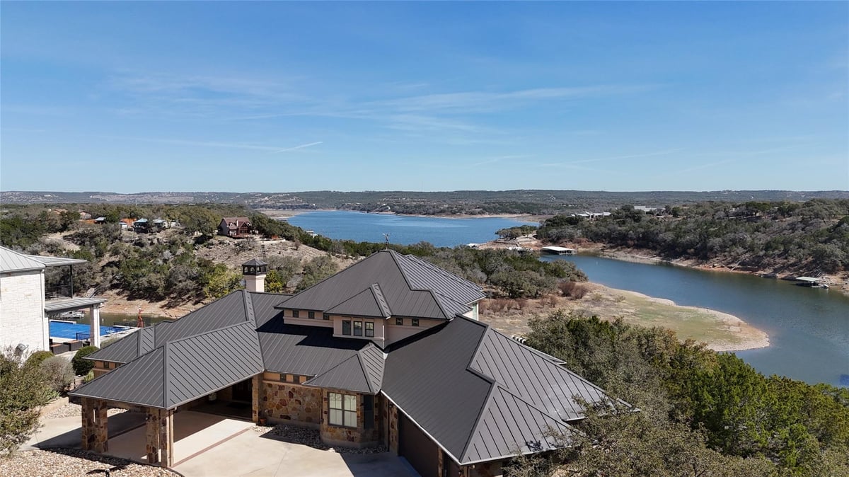 View 128 Carol Cv in Red Bluff Lake Estates 128 Carol Cv - front exterior - Luxury home in Red Bluff Lake Estates, Spicewood, TX