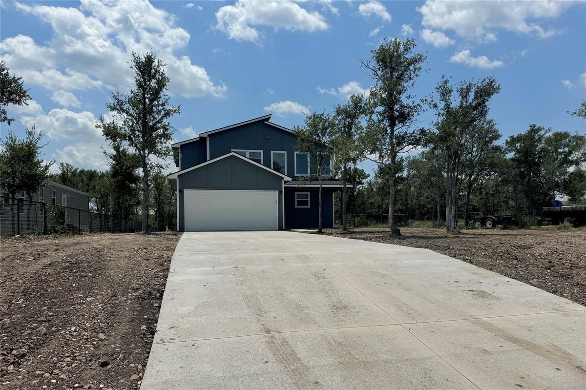 View 128 Passion Vine Rd in Los Milagros Ph 1 128 Passion Vine Rd - property photo 1 - Luxury home in Los Milagros Ph 1, Dale, TX