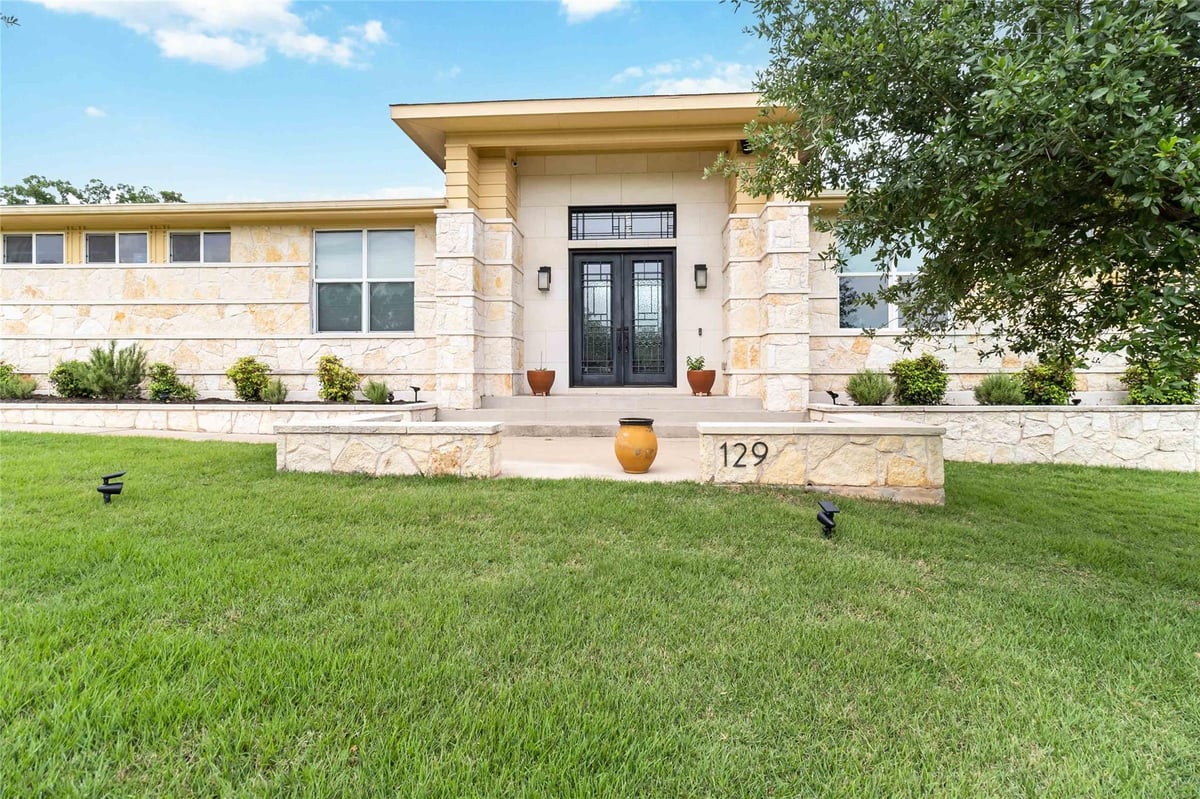 View 129 Powder Horn Rd in The Colony 129 Powder Horn Rd - front exterior - Luxury home in The Colony, Bastrop, TX