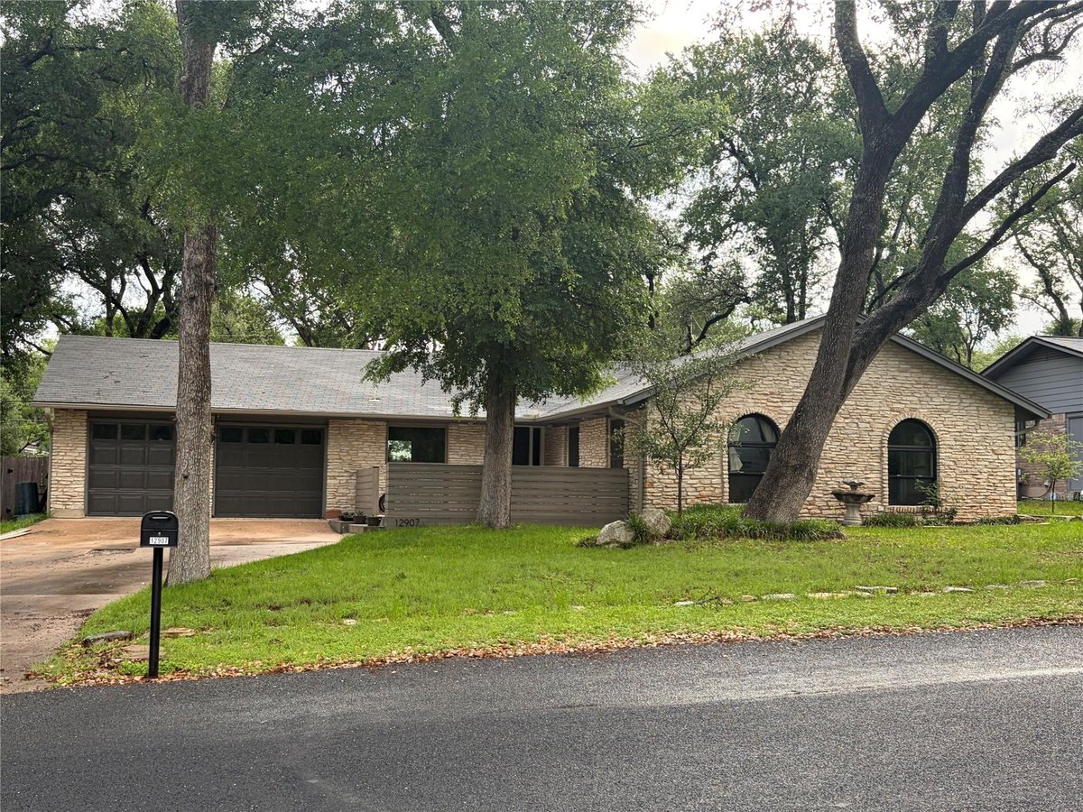 View 12907 Springvale Dr in Village Oaks Sec 3 12907 Springvale Dr - front exterior - Luxury home in Village Oaks Sec 3, Austin, TX