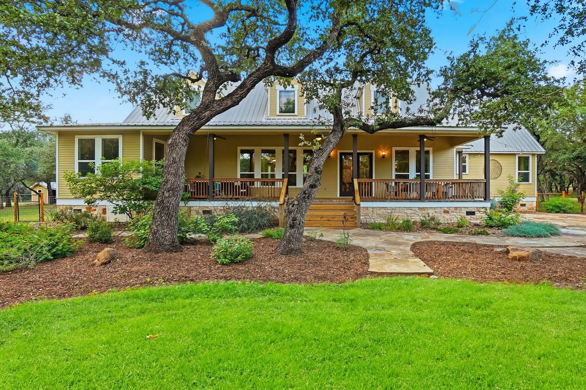 View 130 Canyon Oaks DR in River Oaks Of Wimberley Unit 2 130 Canyon Oaks DR - front exterior - Luxury home in River Oaks Of Wimberley Unit 2, Wimberley, TX