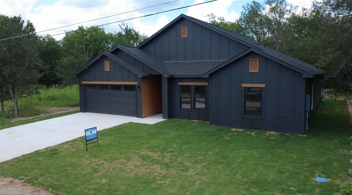 View 130 Waimanalo LN in Tahitian Village 130 Waimanalo LN - front exterior - Luxury home in Tahitian Village, Bastrop, TX