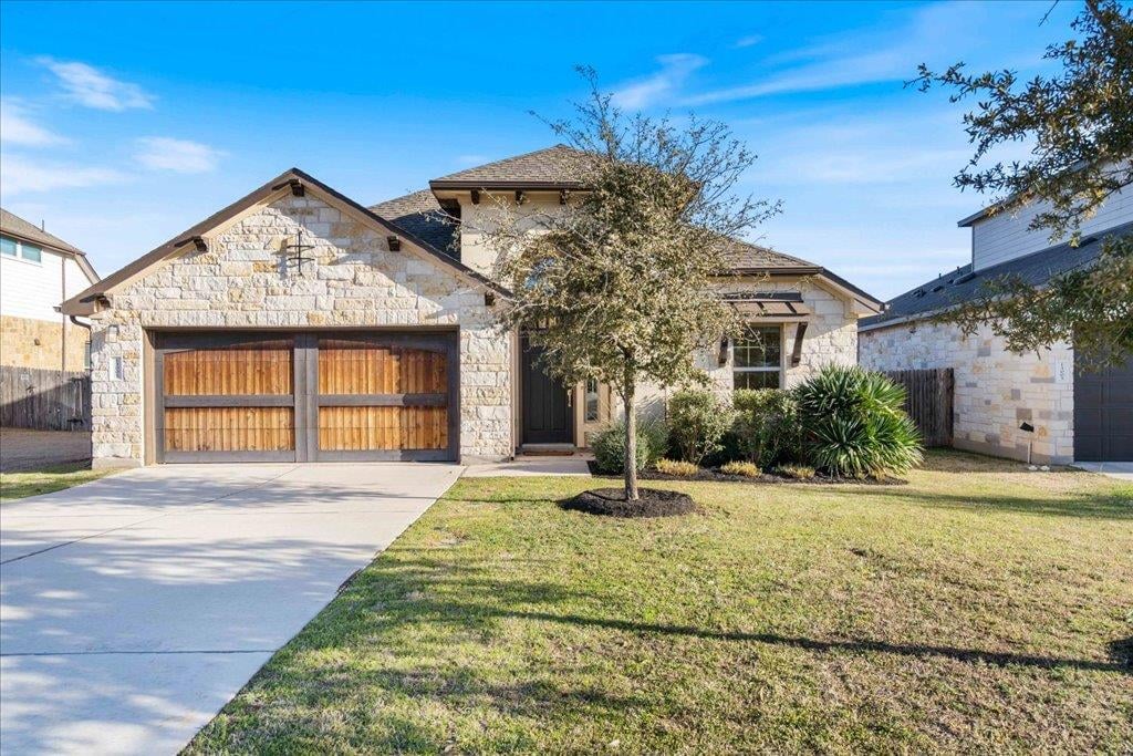 View 13001 Cardinal Flower Dr in Greyrock Ridge 13001 Cardinal Flower Dr - front exterior - Luxury home in Greyrock Ridge, Austin, TX